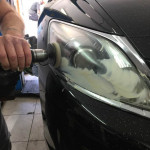 Car front lights being polished